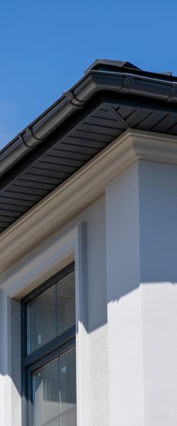 Corner,Of,House,With,Windows,,New,Gray,Metal,Tile,Roof